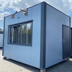 Blaugrauer Imbisscontainer mit großem Schiebefenster, dunkler Tür und Vordachhaltern am Dach